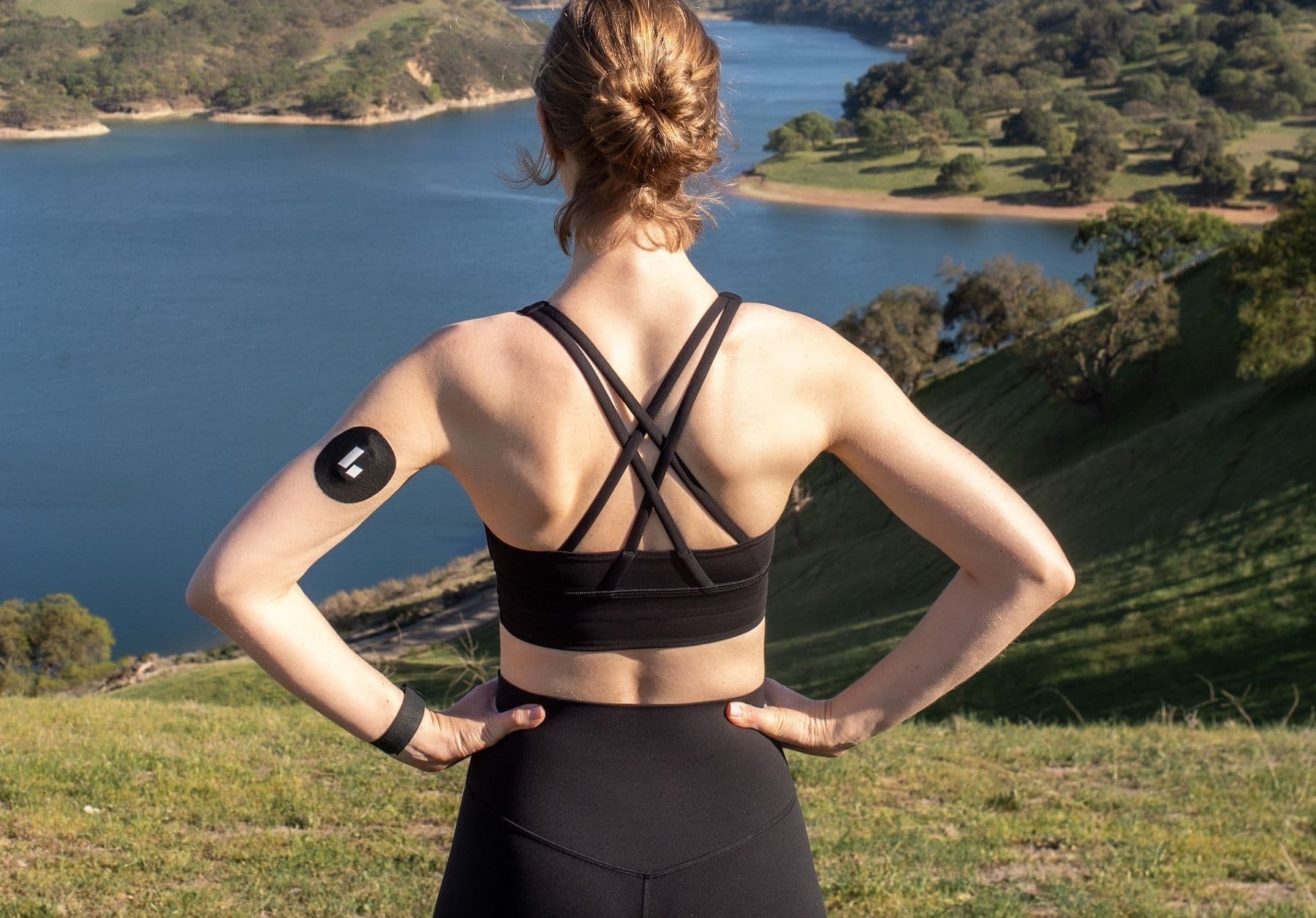 Woman with CGM sensor on her arm